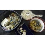 A quantity of various costume jewellery in two boxes along with a plated mirror back