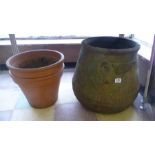 A large terracotta garden pot and two others (1 A/F)