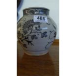 An Oriental blue and white vase with floral decoration