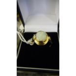 An opal ring set in 9ct gold- total weight 3g