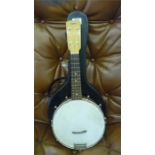 A Welton banjo ukele in hard case, neck repaired