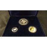 A Ltd edition Guernsey Family set of coins to include a 24ct gold proof £25 coin, silver proof £5