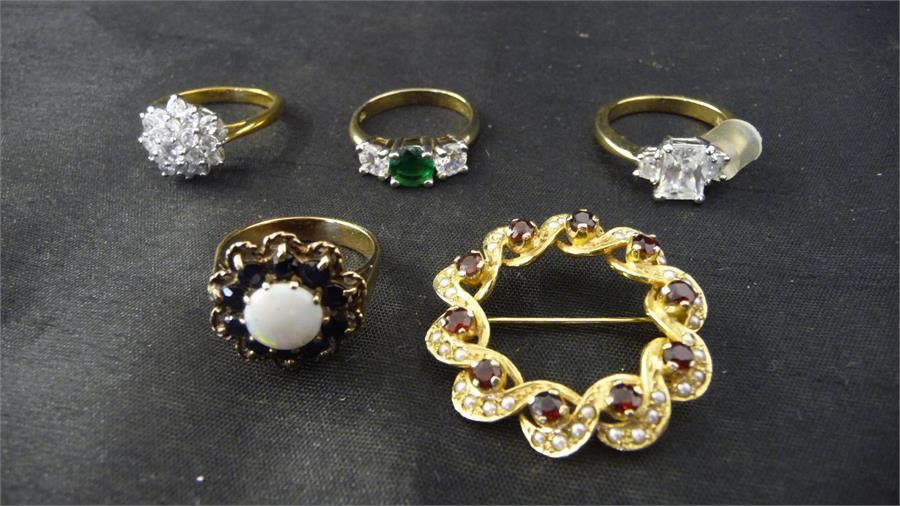 An opal and garnet cluster ring ( unmarked) along with a seed pearl brooch and some dress rings (5)
