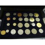 A cased collection of various world coins and medallions including Richard Lionheart Silver Denier