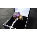 An amethyst ring set in gold ( indistinct hallmark) total weight 4g