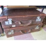 2 vintage leather suitcases and a briefcase