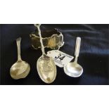 3 silver teaspoons and an ornate serviette ring