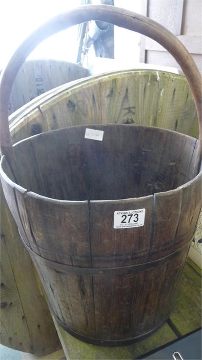 A wooden bucket with metal bindings