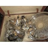A quantity of silver plated items to include a warming plate,in a vintage leather suitcase