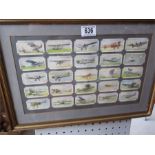 A framed collection of aeroplane cigarette cards