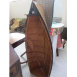 A "model" rowing boat with oars, 4ft 5 inches height