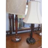 An Edwardian lamp with tapering hexagonal column and one other