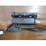 A Crossman air rifle with telescopic sights