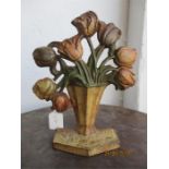 An Art Nouveau cast iron door stop in the form of Tulips in a vase