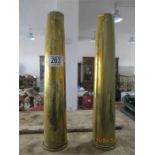 A pair of brass shell casings dated 1943