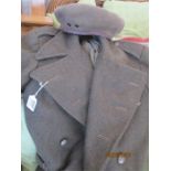 An Army Greatcoat and a khaki beret