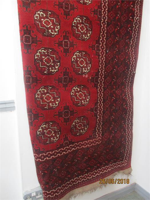 A large red ground rug