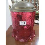 A cranberry glass shade with brass mountings