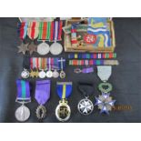 An interesting collection of medals,miniatures, photographs etc. relating to the Clare family.. Mr J