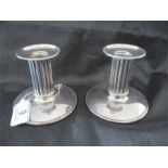 A pair of Danish SCM column candlesticks stamped CC in a crown and Denmark