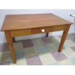 A pine kitchen table with single drawer