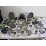 A collection of various geological specimens including an amethyst "cathedral crystal"