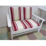 A painted two seater sofa with barley twist supports and shelf under- both seats fold and remove