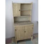 A small painted pine dresser with cupboard under