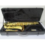 A Brass Tenor Saxophone by Stagg, model number 77-ST, with faux mother of pearl inset keys, in a