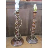 A near pair of mahogany lamps with barley twist stems