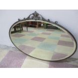 An Edwardian oval mirror