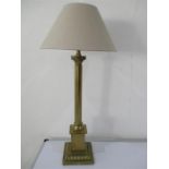 A tall brass Corinthian column lamp