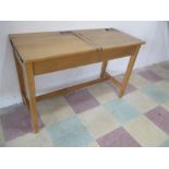 A vintage wooden twin school desk