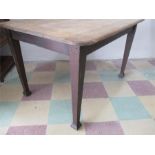 An oak dining table with sanded top