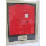 A 1966 World Cup Winners England shirt, signed by members of the team- Geoff Hurst, Alan Ball, Roger