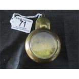 An antique brass miners pocket watch case