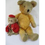 A vintage mohair teddy bear with growler along with a felt faced monkey dressed as a bell boy