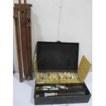 A box of artists materials, easel etc.