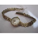 A ladies 9 ct gold Roamer watch with 9 ct gold strap- total weight 13.5g