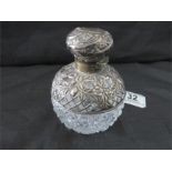 A hallmarked silver and cut glass scent bottle