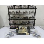 A quantity of Maisto diecast motorbikes with display shelf