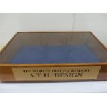 A fly fishing reel table top display cabinet "The Worlds Best Reels by A.T.H Design" (Key in