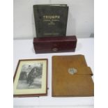 A leather tie box, leather writing case, photograph of Winston Churchill on horseback along with a