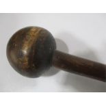 A Zulu darkwood knobkerry, almost spherical head, flared end to staff, 70cm