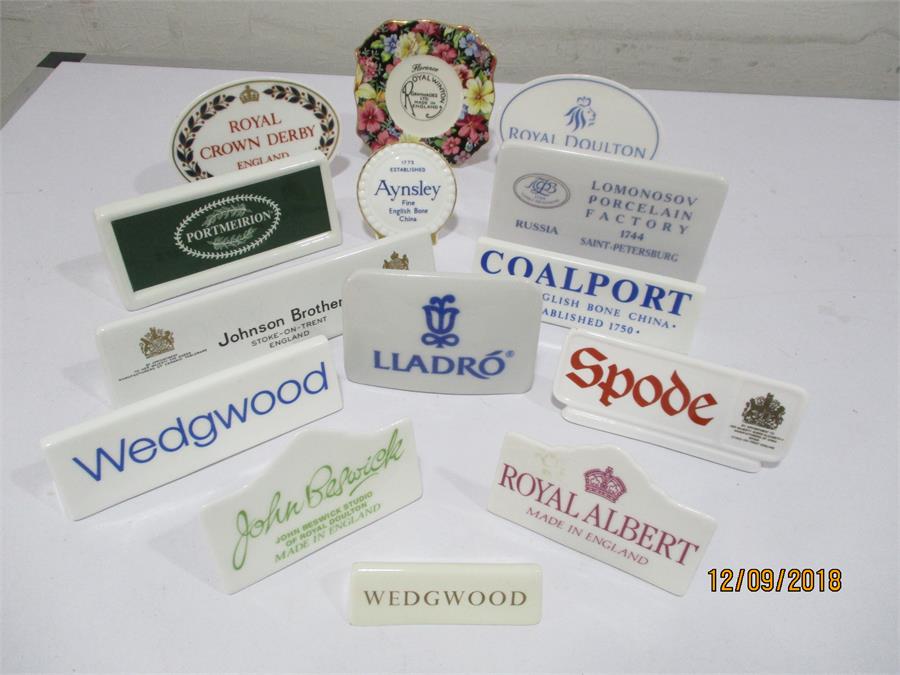 A collection of china "point of sale" name plates including Royal Crown Derby, Beswick, Royal