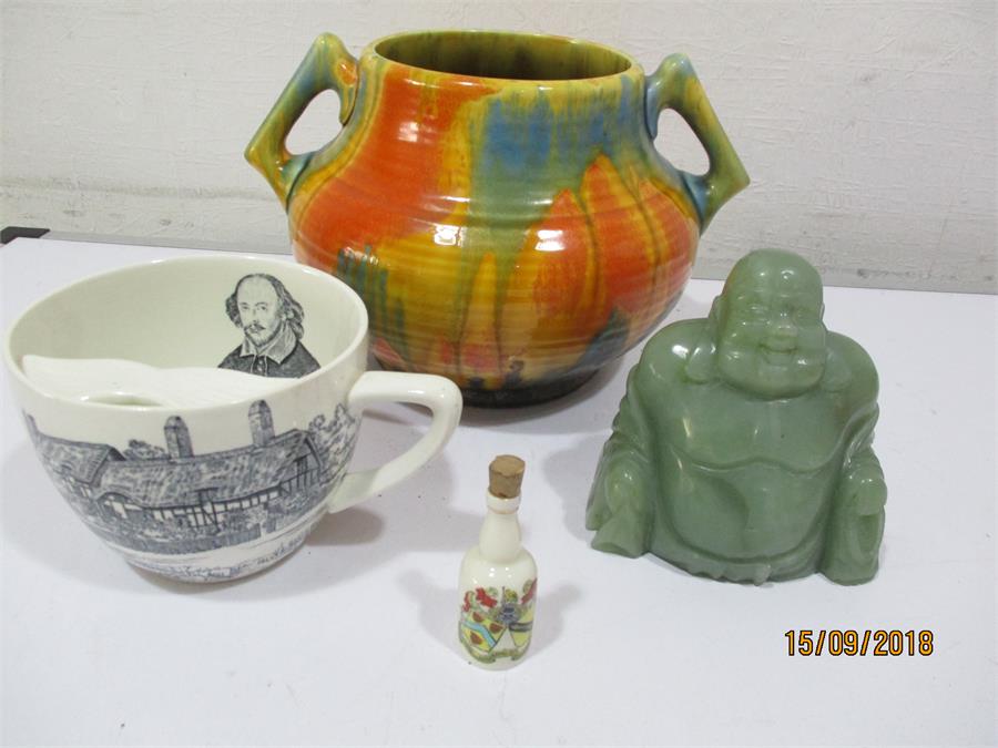 A Crown Ducal Art Deco two handled bowl, a "Jade" Buddha figure, Crown Devon moustache cup decorated