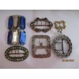 A collection of various antique buckles