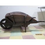 An antique rustic wheelbarrow