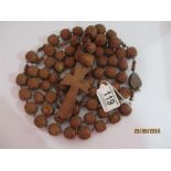 A large vintage Rosary with carved wooden beads, a souvenir of Lourdes