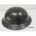 A WWII fibre helmet ( probably Plasfort, used for munitions workers or bomb disposal)